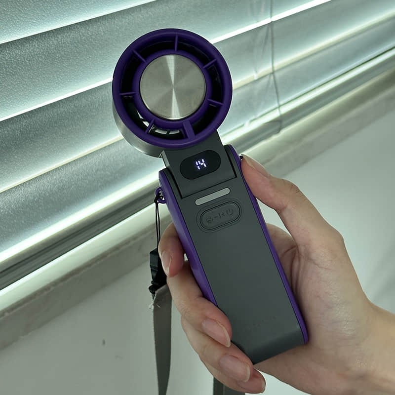 Coolizi portable fan held indoors by a window