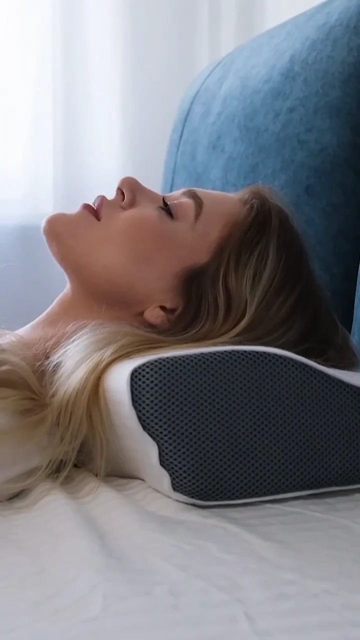 Profile view of a back sleeper on a contoured pillow with mesh side panel