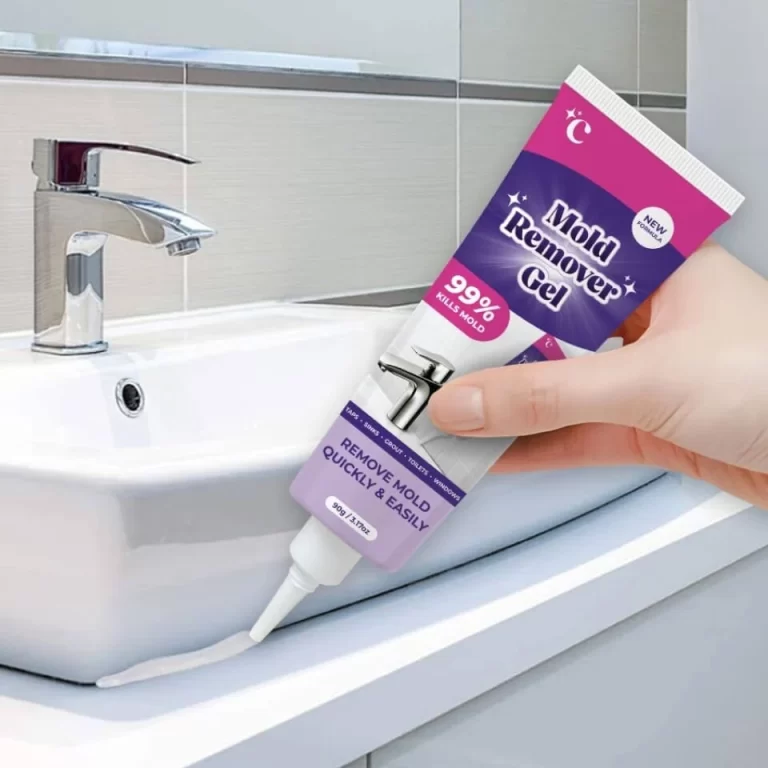 Applying NuroClean Mold Remover Gel along a bathroom sink seal